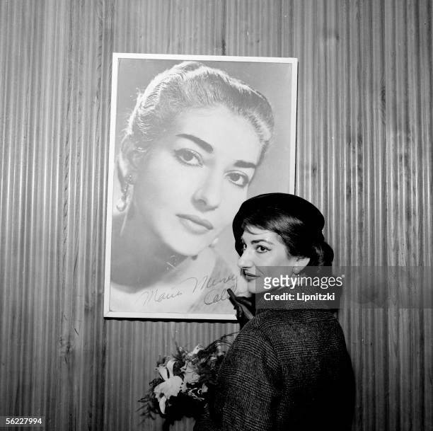 Maria Callas , Greek opera singer, dedicating her portrait, Paris, January 16, 1958.
