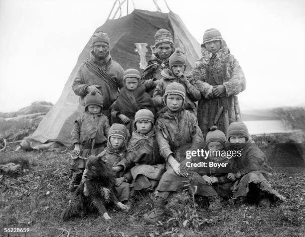 Saami group in front of their hut. Norway, on 1930.