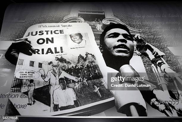 Sign of Ali holding up Nation of Islam newspaper headlined "Justice On Trial" at the Muhammad Ali Center as it opens for media day November 18, 2005...