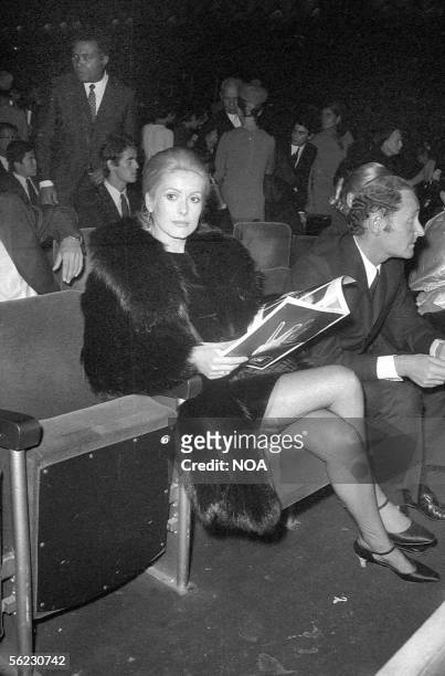 Catherine Deneuve, French actress, and Gilles Dreyfus, lawyer, at a James Brown concert. Paris, Olympia, 1967. HA-1072-24.
