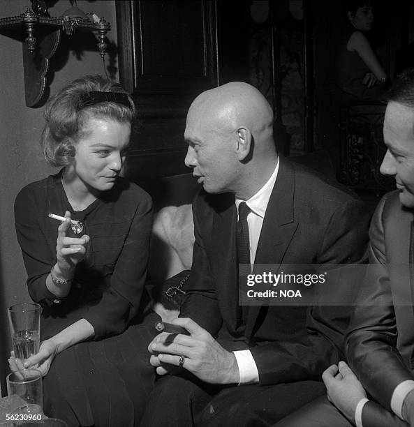 Romy Schneider and Yul Brynner. Paris, Saint-Hilaire Club, 1963. HA-1230-2.