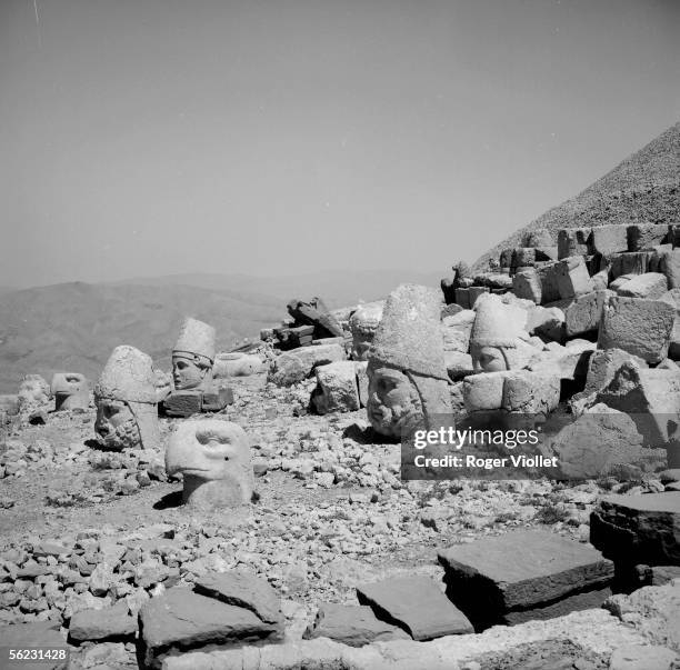 Nemrut Dagi . Heads of former statuaries of Hercules, Apollo and Zeus on the west terrace of the sanctuary of Antiochos I-st , king of Commagene....