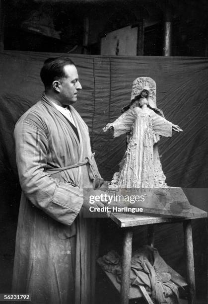 Maxime Real del Sarte , French sculptor, presenting the model of Isabelle Romee 's monument, mother of Joan of Arc. RV-932034.