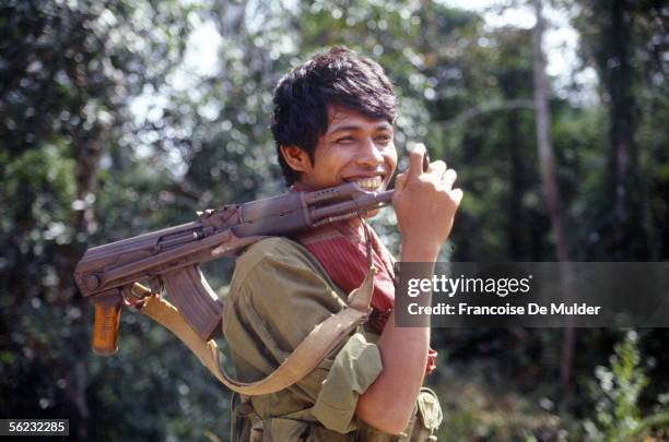 Cambodia. Soldier armed with an AK 47, wearing the "krama" . November 1991. FDM-1985-3.