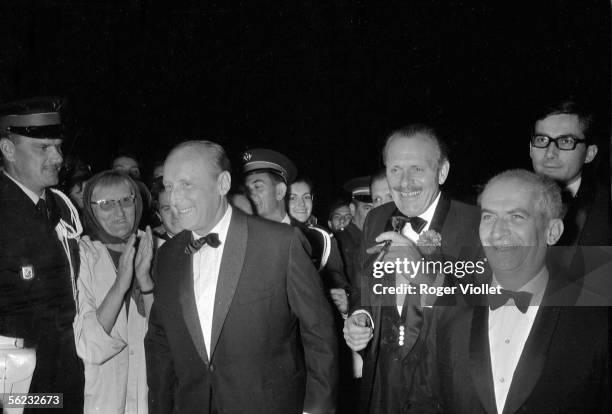 Bourvil, Terry-Thomas and Louis de Funes at the premiere "La Grande Vadrouille" by Gerard Oury at the Cannes Film Festival. France, 1966. HA-1788.