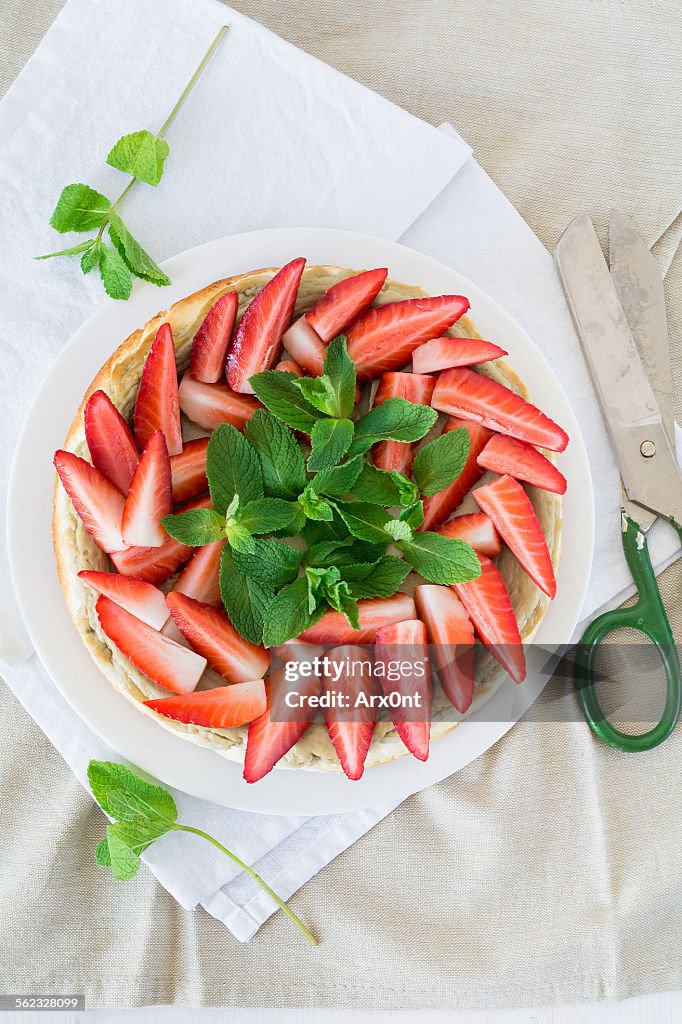 Cheesecake decorated with strawberries