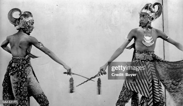 Java, Indonesia. The royal princes in a charasteristic duel with "kris" . 1929. BOY-18719.