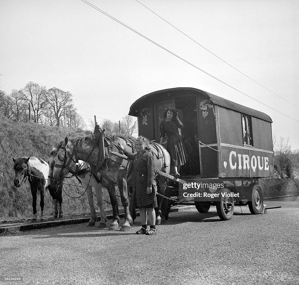 Circus caravan on a road pulled by horses. France, April 1950. News Photo -  Getty Images
