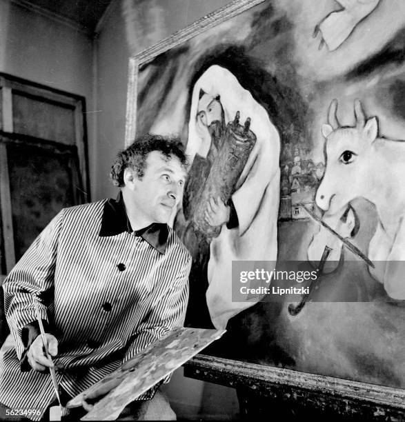 Marc Chagall , French painter, in August in front of the picture "Solitude". 1933. Oil painting, 102x169 cm. Museum of Tel-Aviv.
