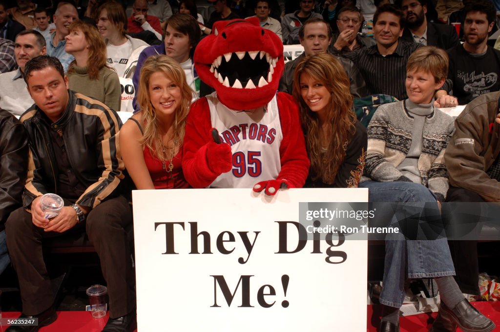 2005 Toronto Raptors Raptor, the mascot of the Toronto Raptors holds a sign that reads ...