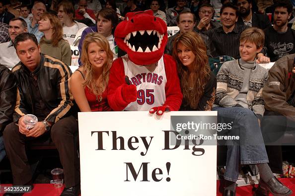 Riverside Raptors Rvc Mascot Raptor, the mascot of the Toronto Raptors holds a sign that reads ...