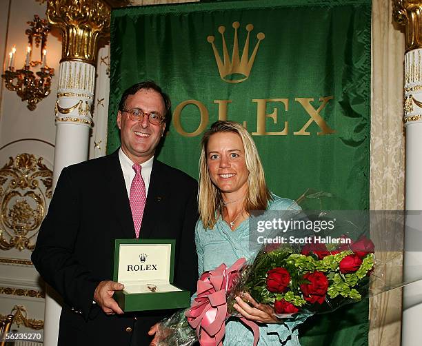 Annika Sorenstam of Sweden, the 2005 Rolex Player of the Year poses with Peter Nicholson of Rolex during the 2005 LPGA awards reception at the...