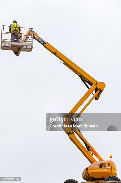 a man on lifting - cherry picker stock pictures, royalty-free photos & images