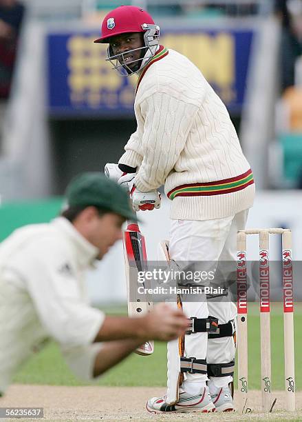 Devon Smith of the West Indies looks back to see Ricky Ponting of Australia take a catch to dismiss him during day three of the Second Test between...