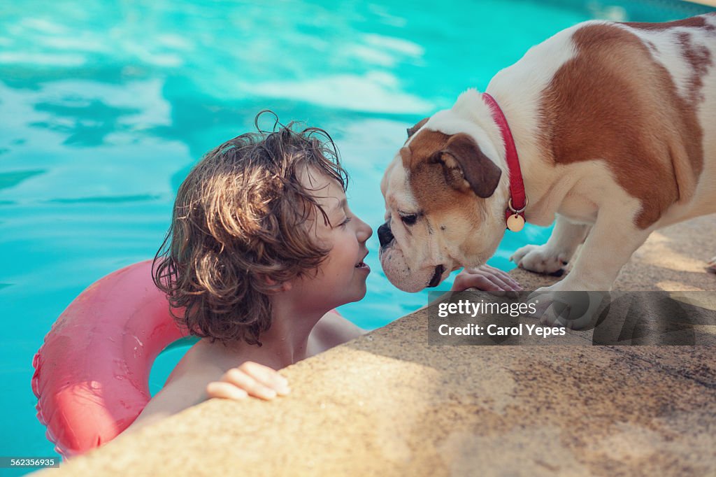 Boy at pool and bulldog