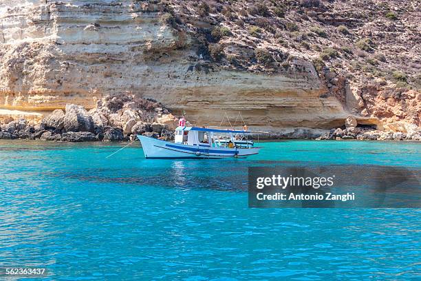 boat on sea of lampedusa - lampedusa stockfoto's en -beelden