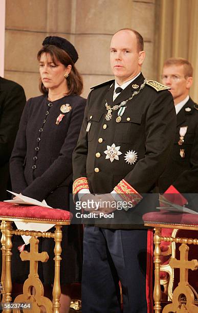 Princess Caroline of Hanover and Prince Albert II of Monaco listen to Mass in the Cathedral during Monaco's National Day celebrations which this year...