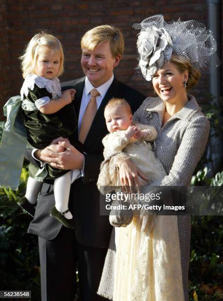 Wassenaar, NETHERLANDS: Crown prince Willem-Alexander holds Princess Amalia while Princess Maxima holds their youngest daughter princess Alexia after...