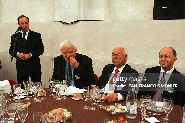 French Socialist party leader Francois Hollande and former PS number 2 Laurent Fabius attend a dinner with the International Socialist leaders at the...