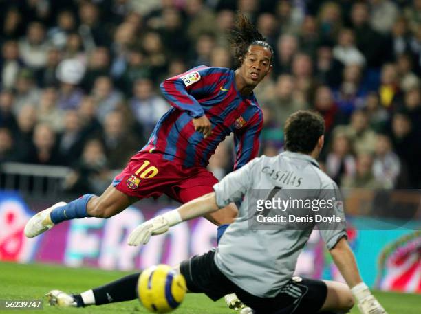 Ronaldinho of Barcelona scores a goal against Real Madrid goalkeeper Iker Casillas during a Primera Liga match between Real Madrid and F.C. Barcelona...