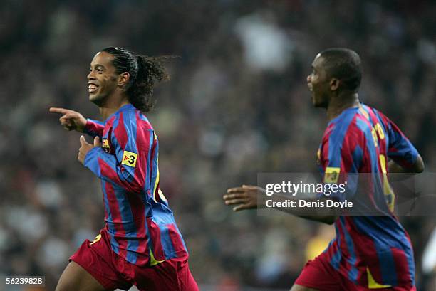 Ronaldinho of Barcelona celebrates with Samuel Eto'o after scoring a goal during a Primera Liga match between Real Madrid and F.C. Barcelona at the...