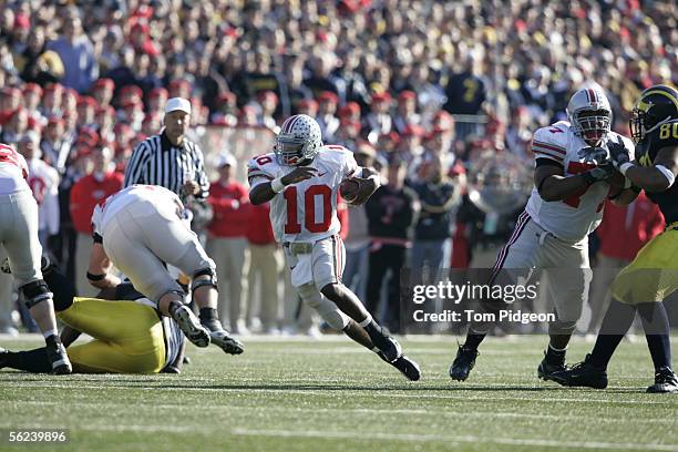 Quarterback Troy Smith of Ohio State runs through an opening against Michigan on November 19, 2005 at Michigan Stadium in Ann Arbor, Michigan. The...