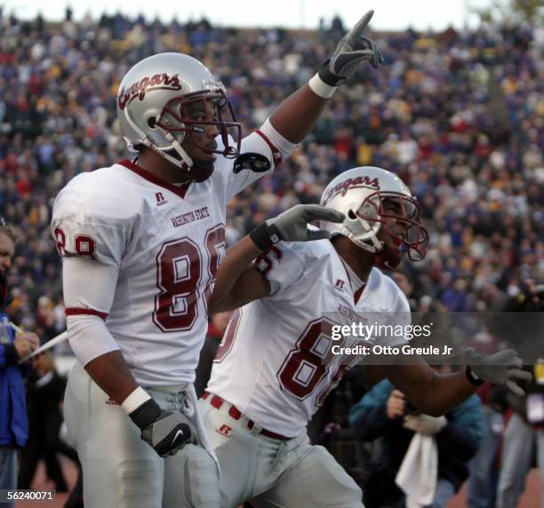 Wide receiver Trandon Harvey of the Washington State Cougars celebrates with Brandon Gibson after scoring a touchdown to take the lead against the...