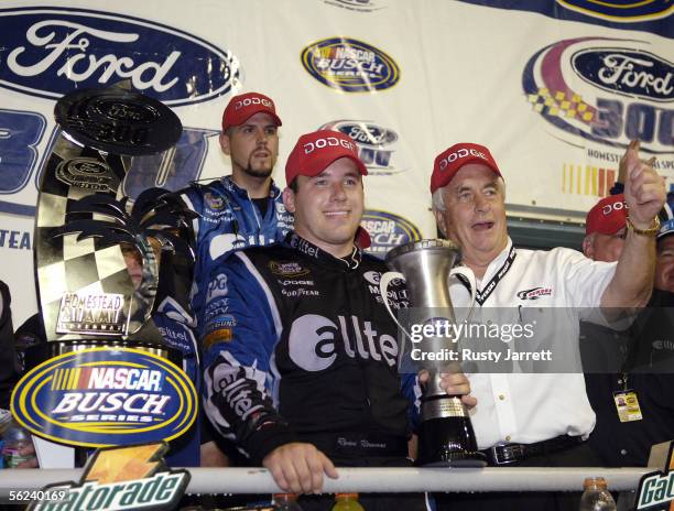 Ryan Newman, driver of the Alltel Dodge, and team owner Roger Penske celebrate winning the NASCAR Busch Series Ford 300 on November 19, 2005 at the...