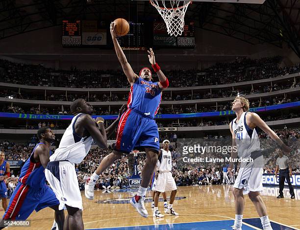 Rasheed Wallace of the Detroit Pistons shoots the ball between DeSagana Diop and Dirk Nowitzki of the Dallas Mavericks on November 19, 2005 at the...