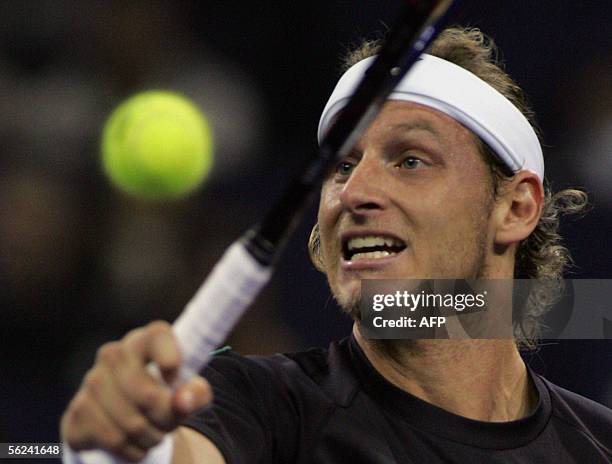 David Nalbandian of Argentina, plays a backhand shot during the finals match against world number one Roger Federer of Switzerland at the 4.45...