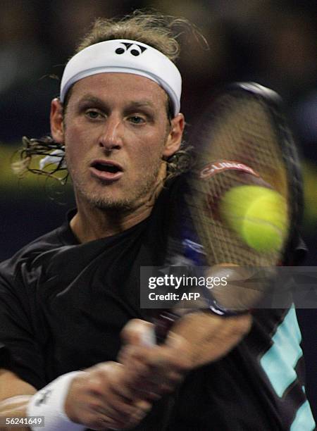 David Nalbandian of Argentina, plays a backhand shot during the finals match against world number one Roger Federer of Switzerland at the 4.45...
