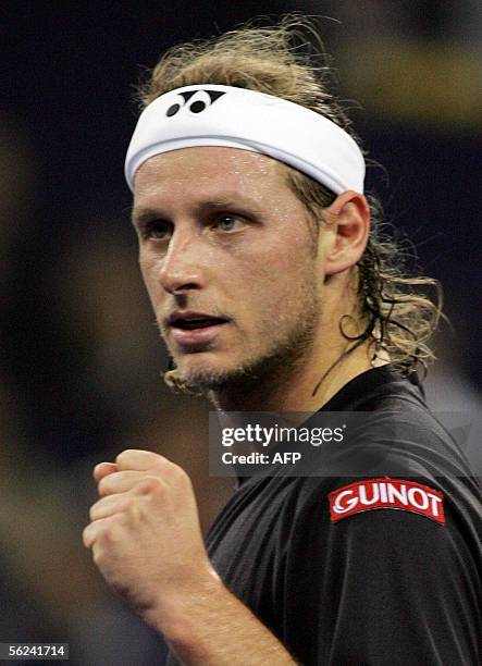 David Nalbandian of Argentina, celebrates winning a point during the finals match against world number one Roger Federer of Switzerland at the 4.45...