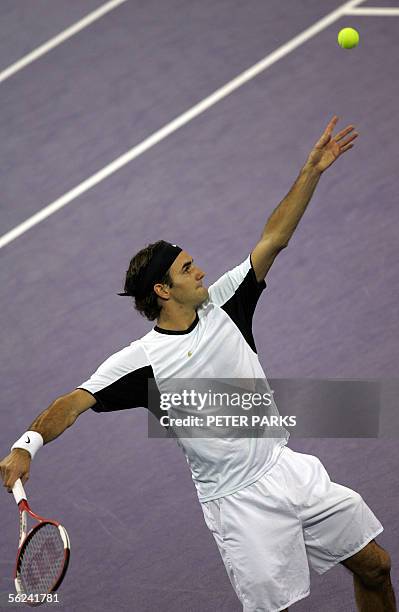 Swiss world number one Roger Federer serves to David Nalbandian of Argentina in the final of the Tennis Masters Cup in Shanghai 20 November 2005....