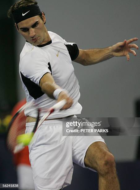 Swiss world number one Roger Federer hits a return to David Nalbandian of Argentina in the final of the Tennis Masters Cup in Shanghai 20 November...