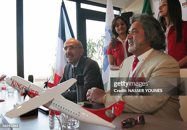 Indian airline Kingfisher owner Vijya Mallya is seen near ATR CEO Filippo Bagnato during a press conference to announce a 350 million US dollar deal...