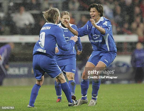 Conny Pohlers and Ariane Hingst of Potsdam jubilate after Pohlers scored 2-0 during the UEFA Women's Cup Semi Final match between 1.FC Turbine...