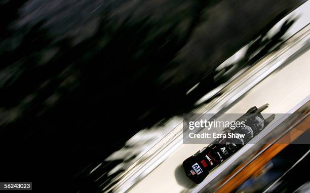 The US team with Todd Hays driving and Pavle Jovanovic, Steve Mesler, and Garrett Hines race down the track during heat 1 of the FIBT Men's Four-Man...