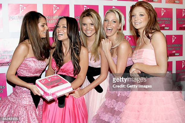 Girls Aloud Cheryl Tweedy, Kimberley Walsh, Nadine Coyle, Sarah Harding and Nicola Roberts pose with a birthday cake for Kinberley in the press room...