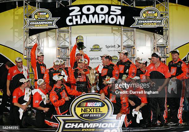 Tony Stewart, driver of the Home Depot Chevrolet, celebrates winning the championship with his crew after the NASCAR Nextel Cup Ford 400 on November...