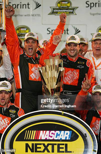 Tony Stewart, driver of the Home Depot Chevrolet, celebrates winning the championship with his crew chief Greg Zipedelli during the NASCAR Nextel Cup...