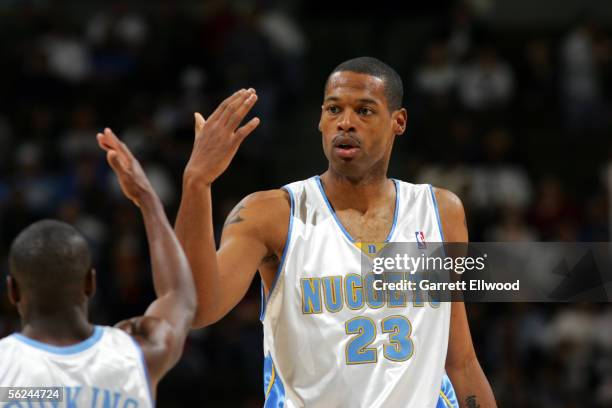 Marcus Camby of the Denver Nuggets celebrates with Earl Boykins during the game against the Memphis Grizzlies on November 20, 2005 at the Pepsi...