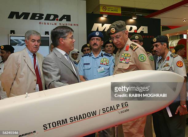 Saudi General Saleh Ali al-Muhaya , Cheif of Staff of the Saudi Royal Air force, looks at a model of the French missile, Storm Shadow, at the Dubai...