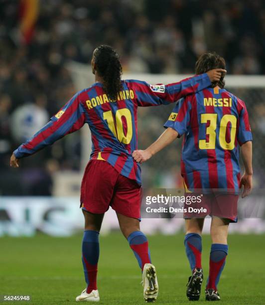 Ronaldinho of Barcelona celebrates with Lionel Messi after scoring a goal during the Primera Liga match between Real Madrid and F.C. Barcelona at the...