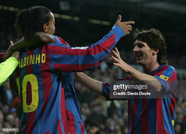 Ronaldinho of Barcelona celebrates with Lionel Messi after scoring a goal during the Primera Liga match between Real Madrid and F.C. Barcelona at the...