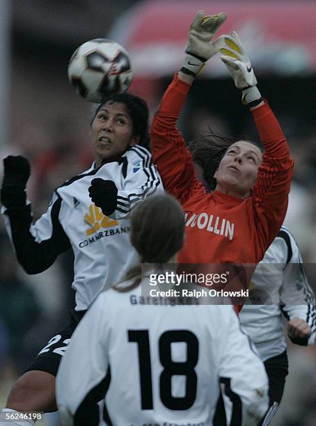 Steffie Jones of 1.FFC Frankfurt challenges keeper of Montpellier HSC, Celine Deville, for the ball during the UEFA Women's Cup Semi Final match at...