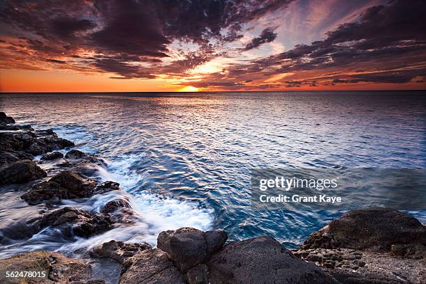 kaunolu coast at sunset, lana`i, hawai`i - lanai stock pictures, royalty-free photos & images