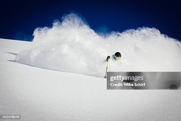 a man skiing powder on a beautiful sunny day in utah - utah skiing stock pictures, royalty-free photos & images