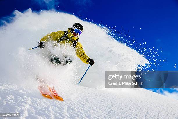 a man skiing fresh powder. alta, utah - alta utah stock pictures, royalty-free photos & images