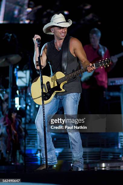 American country musician Kenny Chesney performs with his band onstage at Soldier Field, Chicago, Illinois, June 13, 2009.