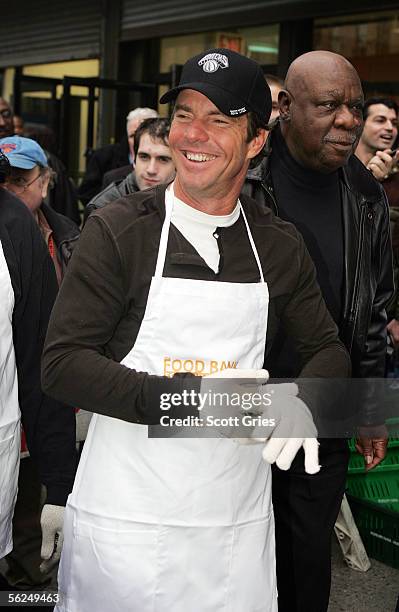 Actor Dennis Quaid and former New York Knick Cal Ramsey help unload turkeys for an early Thanksgiving dinner at the FoodChange Community Kitchen...